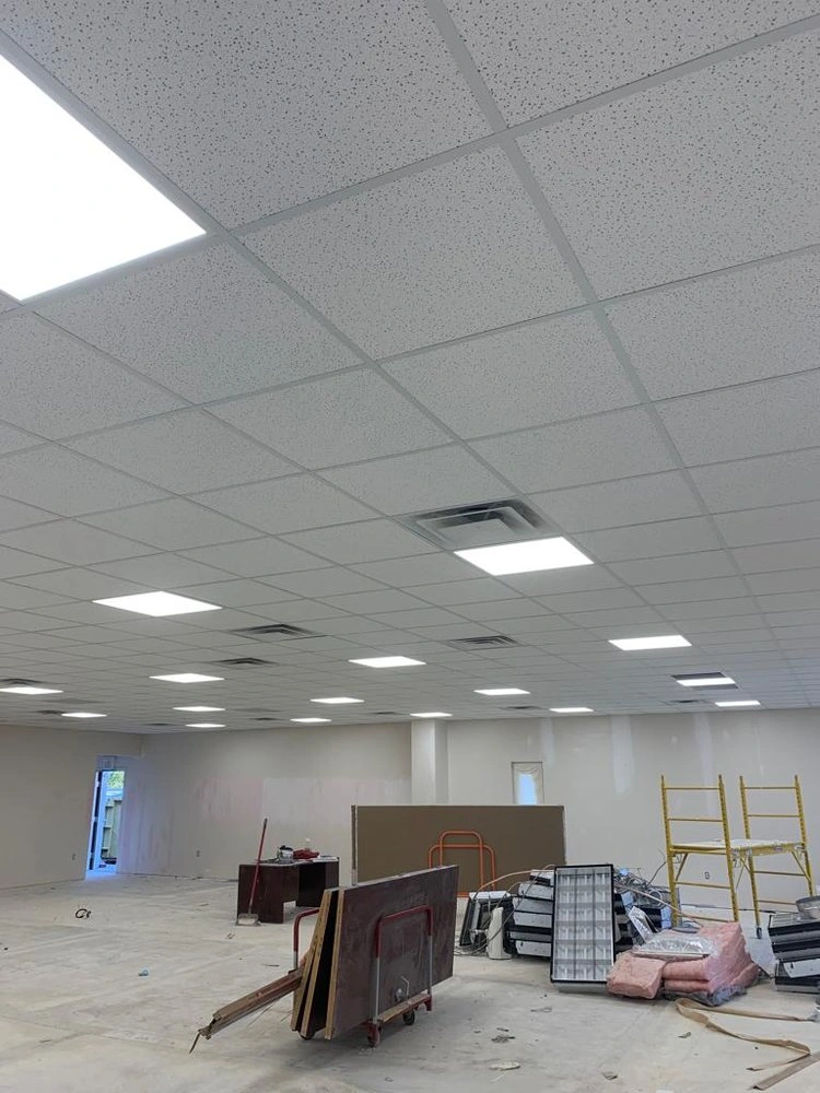Installed acoustic ceiling tiles and lighting