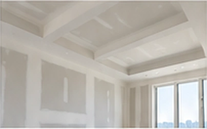Drywall installation and finishing in a bright interior